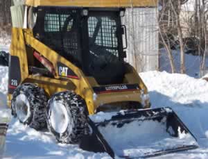 Snow Removal with our CAT 216 Skidsteer
